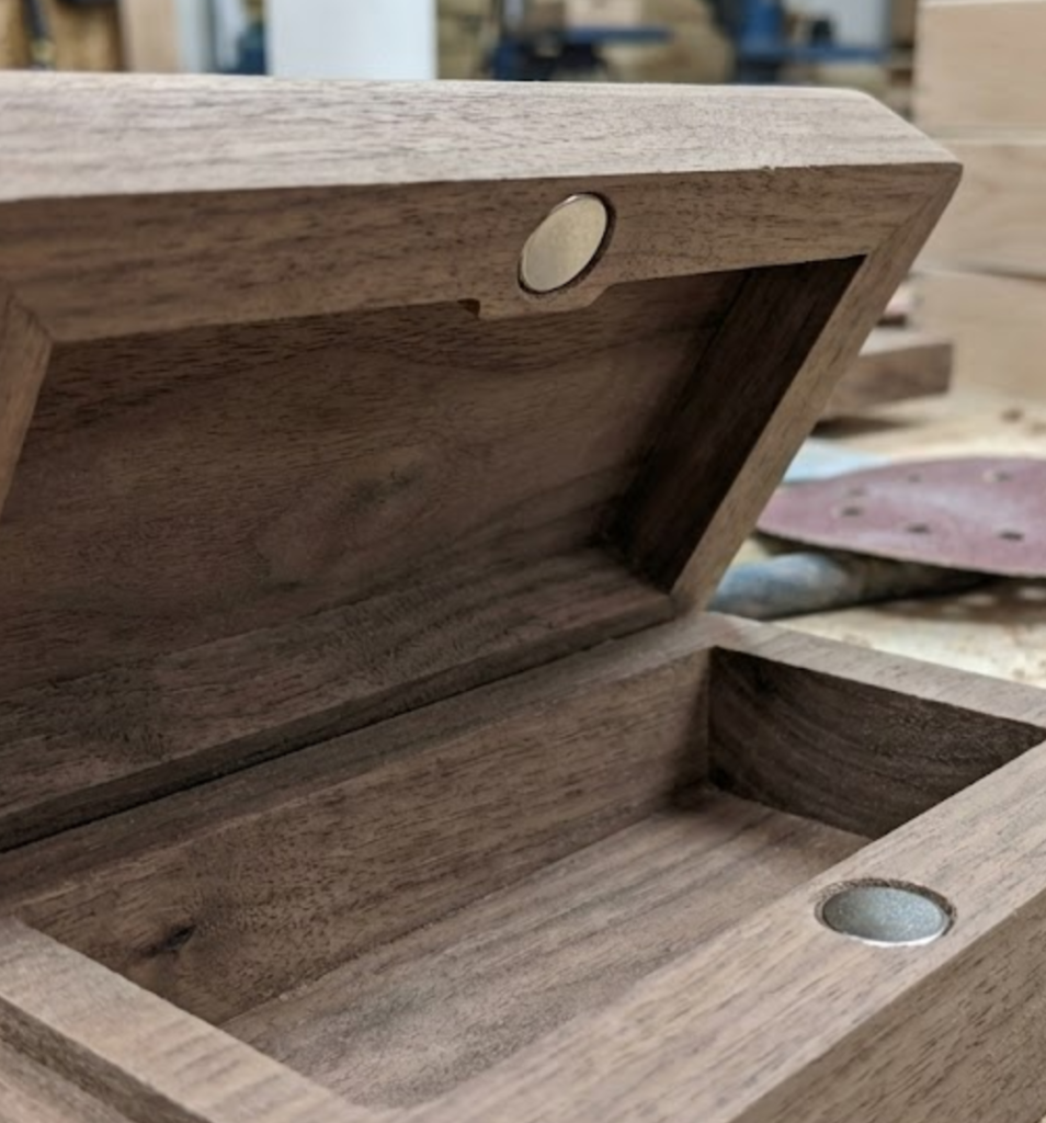 magnetic lid alignment detail in wooden chocolate box factory production